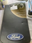 Plasticolor 0579 Universal Ford Mud Guards 9" X 15" With Logo - Pair. Fixed Price $25.00.